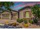 Beautiful single-story home showcasing a three-car garage and desert landscaping, with shuttered windows at 4361 S Electron --, Mesa, AZ 85212