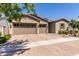 Charming desert home with a three-car garage, beautiful plants, and desert landscaping at 4361 S Electron --, Mesa, AZ 85212