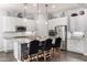 Bright kitchen showcasing white cabinetry, granite countertops, stainless steel appliances, and an island with seating at 4361 S Electron --, Mesa, AZ 85212
