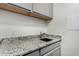 Laundry room with granite countertops and modern shaker style cabinets at 4361 S Electron --, Mesa, AZ 85212