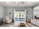 Cozy living room with tile floors, modern furniture, and a view of the backyard at 4361 S Electron --, Mesa, AZ 85212