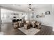 Open-concept living room with tile floors, furniture, and kitchen in the background at 4361 S Electron --, Mesa, AZ 85212