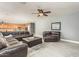 Comfortable living room with hardwood floors and spacious, open-concept layout at 44566 W High Desert Trl, Maricopa, AZ 85139