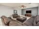 Inviting living room with stylish decor, hardwood floors, and comfortable leather seating at 44566 W High Desert Trl, Maricopa, AZ 85139