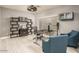 Home office with modern decor, neutral colors, and an abundance of natural light at 44566 W High Desert Trl, Maricopa, AZ 85139
