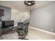 Comfortable office space with modern fan lighting and neutral wall paint at 44566 W High Desert Trl, Maricopa, AZ 85139