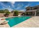 Private swimming pool with adjacent covered patio at 44566 W High Desert Trl, Maricopa, AZ 85139