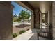 Covered front porch with a bench seat perfect for enjoying the neighborhood views at 44566 W High Desert Trl, Maricopa, AZ 85139