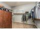 Spacious walk-in closet with clothing racks and shelving for storage at 44566 W High Desert Trl, Maricopa, AZ 85139