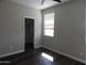 Bedroom features closet with sliding doors and a window, providing plenty of natural light at 4514 N 198Th Ln, Litchfield Park, AZ 85340
