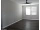 The bedroom has hardwood floors and two windows with blinds at 4514 N 198Th Ln, Litchfield Park, AZ 85340