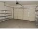 The garage is spacious and features shelving units for optimal organization at 4514 N 198Th Ln, Litchfield Park, AZ 85340