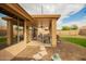 Covered patio extends outdoor living space, with stone walkway to backyard at 4909 W Pedro Ln, Laveen, AZ 85339