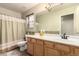 Bathroom with a vanity, large mirror, and shower, providing a clean and functional space at 4909 W Pedro Ln, Laveen, AZ 85339