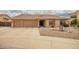 Charming single-story home boasting a three-car garage, low maintenance desert landscaping, and neutral colored stucco at 4909 W Pedro Ln, Laveen, AZ 85339