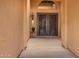 A welcoming front entrance featuring a decorative wrought iron double door and classic sconce lighting at 4909 W Pedro Ln, Laveen, AZ 85339