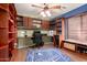 This home office features built-in shelves and desk space for working at home at 4909 W Pedro Ln, Laveen, AZ 85339