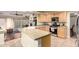 Open kitchen with stainless steel appliances and access to breakfast nook and living area at 4909 W Pedro Ln, Laveen, AZ 85339