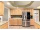 Kitchen area features stainless steel refrigerator and lots of cabinet space at 4909 W Pedro Ln, Laveen, AZ 85339