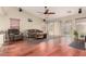 Spacious living room features hardwood floors, ceiling fan, and sliding glass doors at 4909 W Pedro Ln, Laveen, AZ 85339