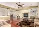 Inviting living room features a fireplace, hardwood floors, and a ceiling fan at 4909 W Pedro Ln, Laveen, AZ 85339