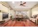 Cozy living room featuring a fireplace, plush sofa, and a bay window offering ample natural light at 4909 W Pedro Ln, Laveen, AZ 85339