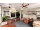 Open concept living room flows into kitchen area, with hardwood floors and fireplace at 4909 W Pedro Ln, Laveen, AZ 85339