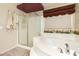 The primary bathroom features a shower, soaking tub, and lots of counter space at 4909 W Pedro Ln, Laveen, AZ 85339