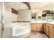 The primary bathroom features a large tub, vanity, and tiled floors at 4909 W Pedro Ln, Laveen, AZ 85339