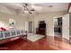 The spacious main bedroom features wood floors, a ceiling fan, and a walk-in closet at 4909 W Pedro Ln, Laveen, AZ 85339