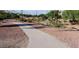 Community walking path is surrounded by lush landscaping, perfect for exercise and enjoying nature at 4909 W Pedro Ln, Laveen, AZ 85339