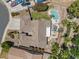 Aerial view of the backyard featuring a pool, spa, patio, and lush landscaping, surrounded by a well-maintained neighborhood at 5410 E Gable Ave, Mesa, AZ 85206
