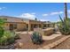 Backyard featuring a pergola, built-in barbecue, pool and desert landscaping at 5410 E Gable Ave, Mesa, AZ 85206