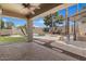Backyard with a pool, spa, covered patio, fire pit, and lush landscaping at 5410 E Gable Ave, Mesa, AZ 85206