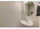 A half bathroom featuring a pedestal sink and a towel rack at 5410 E Gable Ave, Mesa, AZ 85206