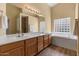 Bathroom features a double vanity, tub, and tile accents, perfect for relaxation and style at 5410 E Gable Ave, Mesa, AZ 85206