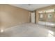 Bedroom with mirrored closet doors and a ceiling fan; ample space offers versatile use at 5410 E Gable Ave, Mesa, AZ 85206