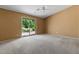 Spacious bedroom with a sliding glass door leading to the backyard and a ceiling fan for added comfort at 5410 E Gable Ave, Mesa, AZ 85206