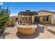Covered fire pit with outdoor kitchen and backyard patio at 5410 E Gable Ave, Mesa, AZ 85206