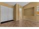 Open foyer with neutral tile flooring and ample natural light, providing a welcoming entrance at 5410 E Gable Ave, Mesa, AZ 85206