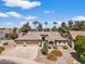 Charming single-story home with a well-manicured front yard, desert landscaping, and a three-car garage at 5410 E Gable Ave, Mesa, AZ 85206