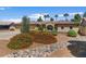 Attractive desert landscaping complements this home's exterior and includes drought-resistant plants at 5410 E Gable Ave, Mesa, AZ 85206