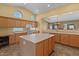 Bright kitchen showcasing an island, stainless appliances and a large window at 5410 E Gable Ave, Mesa, AZ 85206