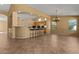 Open-concept kitchen with a breakfast bar, perfect for casual dining and entertaining guests at 5410 E Gable Ave, Mesa, AZ 85206