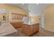Well-lit kitchen with an island, providing ample counter space for food preparation and Gathering gatherings at 5410 E Gable Ave, Mesa, AZ 85206