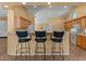 Kitchen featuring seating at the breakfast bar and stainless steel appliances at 5410 E Gable Ave, Mesa, AZ 85206