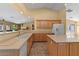 Bright kitchen featuring a functional island and stainless steel dishwasher at 5410 E Gable Ave, Mesa, AZ 85206