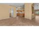 Bright open living area with tile flooring showcasing the flow into the kitchen providing the perfect space for entertaining at 5410 E Gable Ave, Mesa, AZ 85206