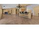 Open living space showcasing seamless integration of the living room and kitchen area with plenty of natural light at 5410 E Gable Ave, Mesa, AZ 85206