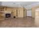 Spacious living room featuring a cozy fireplace and ample natural light, creating an inviting atmosphere at 5410 E Gable Ave, Mesa, AZ 85206
